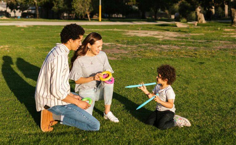 Dad and mom playing with cute kid