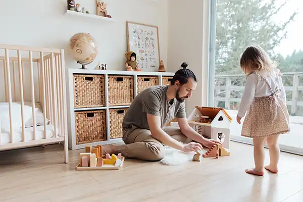 Dad and cute daughter activity bonding play with doll house